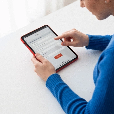 User submitting online form on tablet