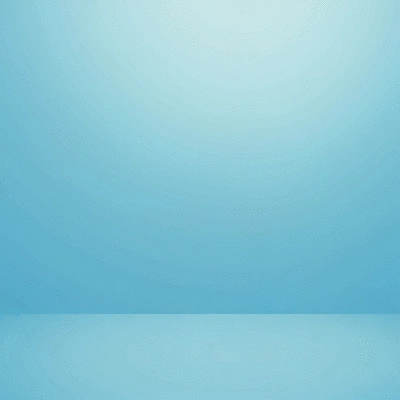 Overhead view of a person's hands planting flowers in a garden bed