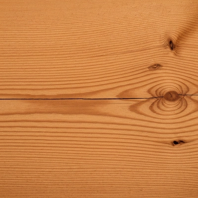 Close-up of natural cedar wood grain texture, showing durability